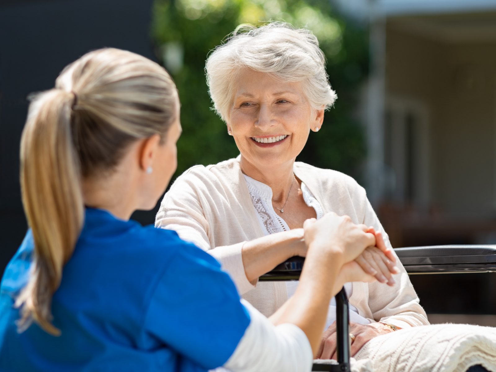 A support worker helping a client with her morning routine