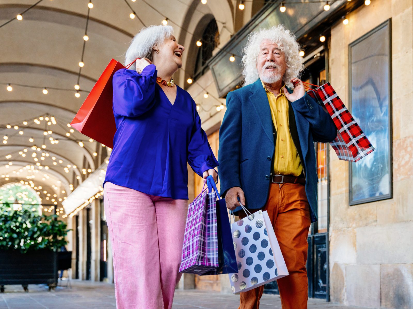 A support worker and a client choosing groceries together at a local shop